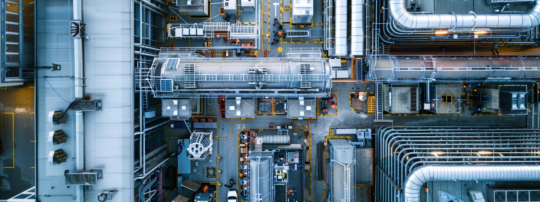 a detailed overhead shot of a bustling commercial hvac installation site in an urban environment, showcasing technicians expertly maneuvering equipment amid a backdrop of modern buildings and industrial machinery.